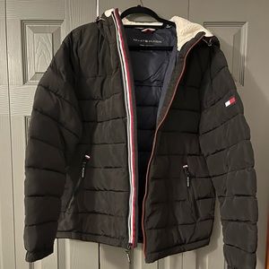 Men’s Tommy Hilfiger black down coat with fur lined hood. Size large.